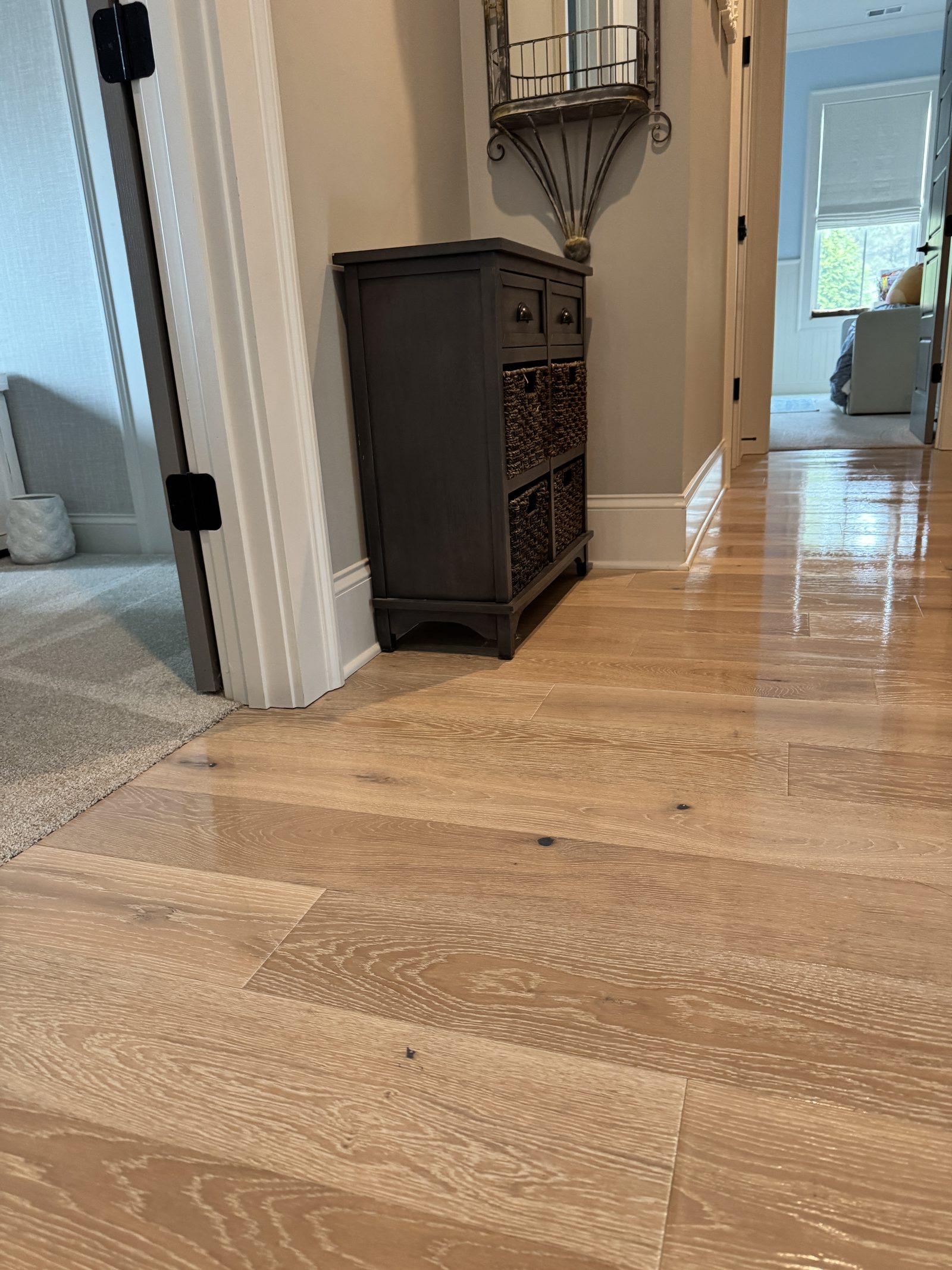 Detail of a spotless hardwood hallway after a Veras Maids cleaning